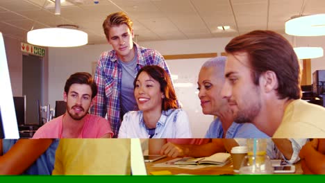 Colleagues-having-discussion-at-desk