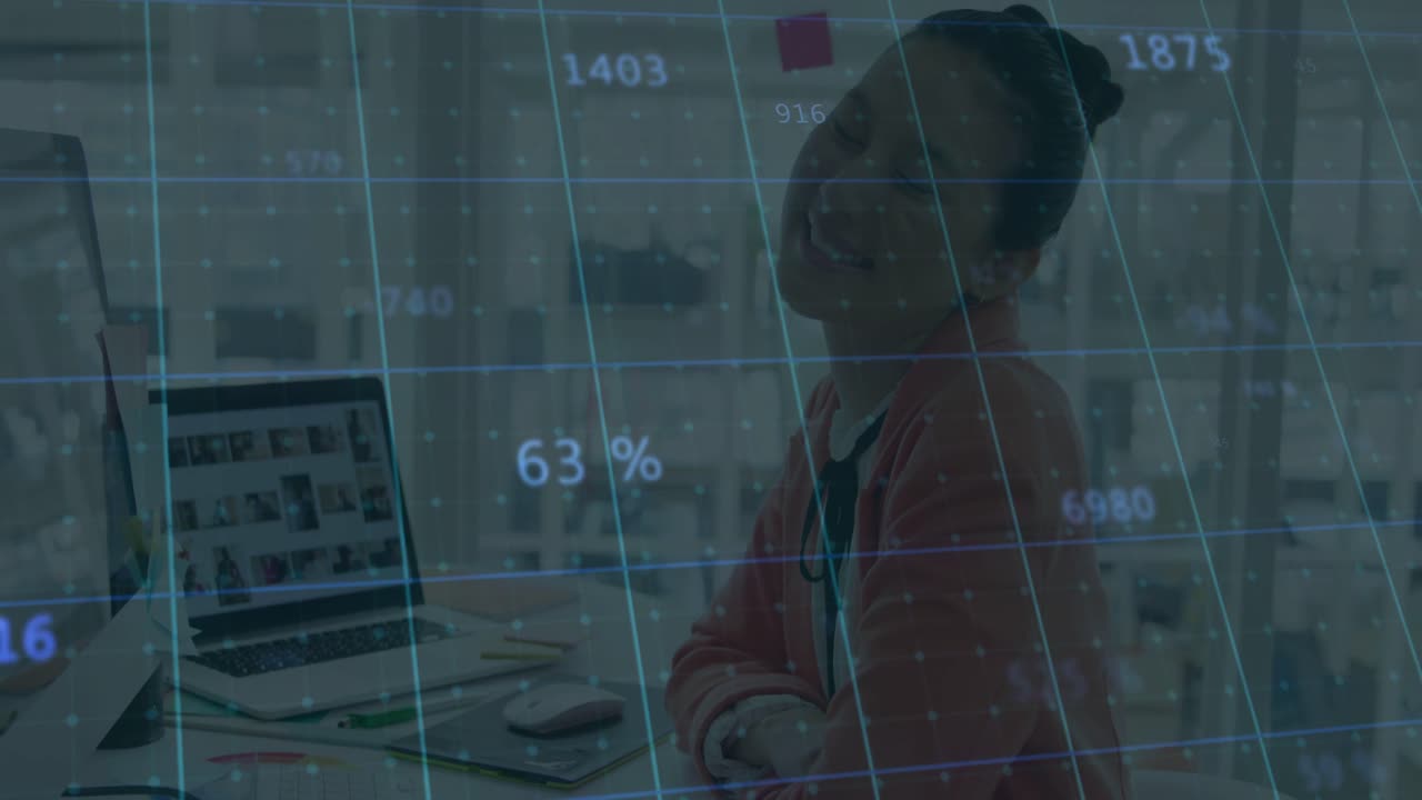 Analyst typing on laptop at desk, scrolling data grid overlay guiding review, folding arms smiling