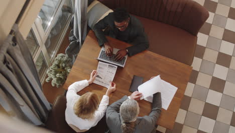 business team discussing project in restaurant