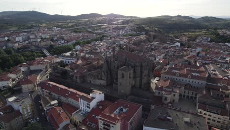 aerial establishing view of baroque style catedral nueva, rising up in plasencia