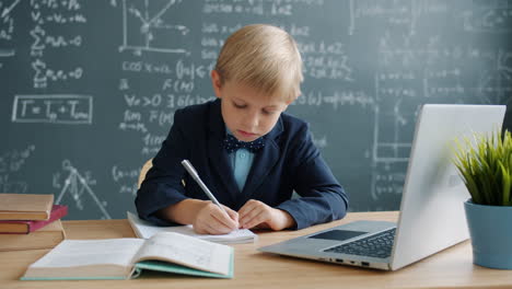 young student studying at desk