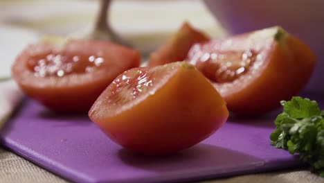 sliced tomatoes on a purple cutting board