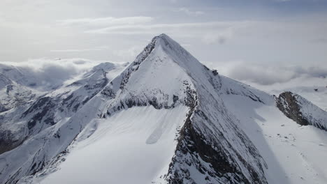 drone panoramic shot of snow-covered mountains in austria during sunny day - kitzsteinhorn, salzburg