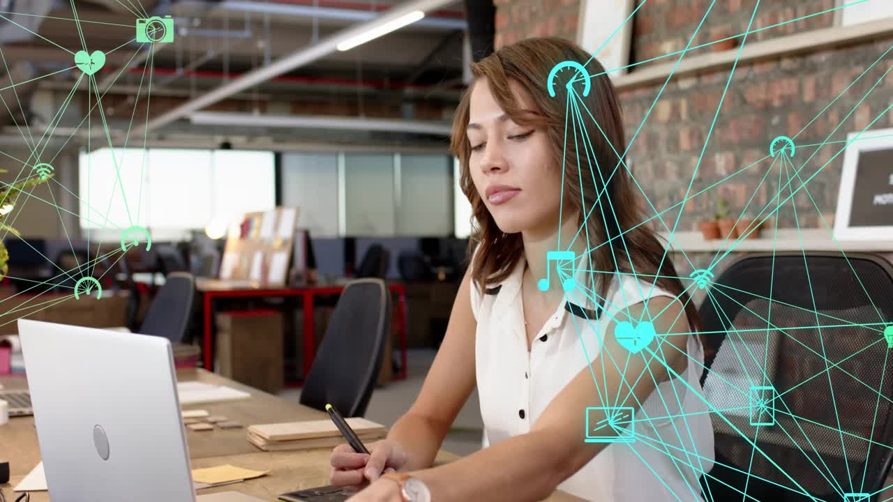 Female designer using tablet in office noticing screen leaning resuming drawing teal net overlay