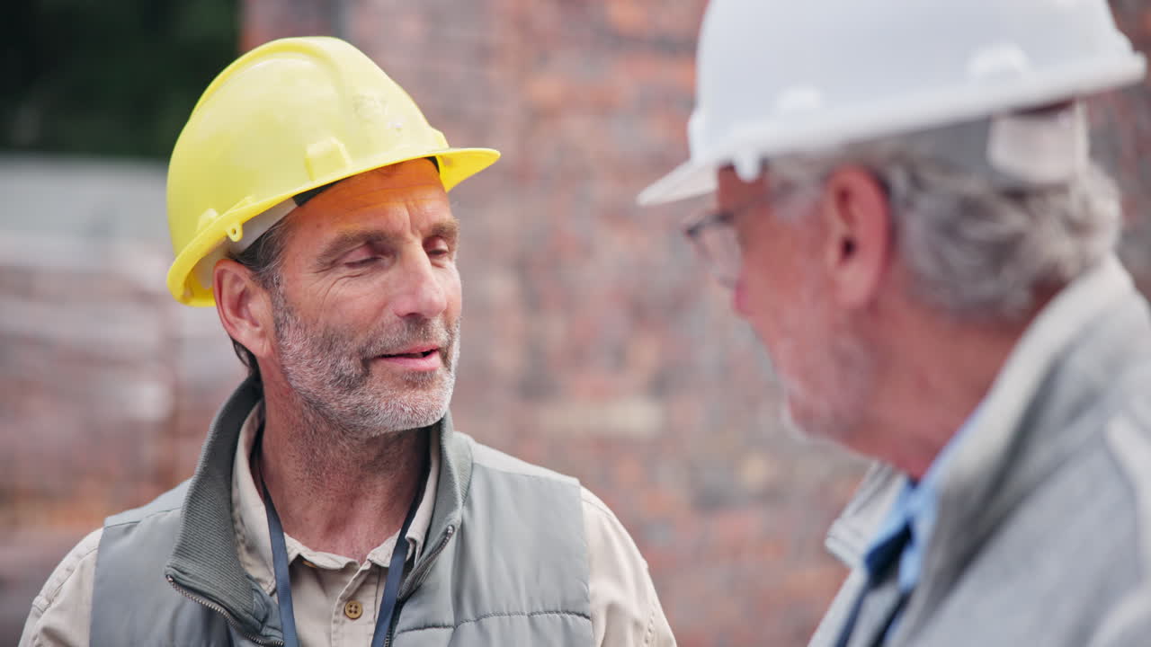 Construction workers discussing project on site