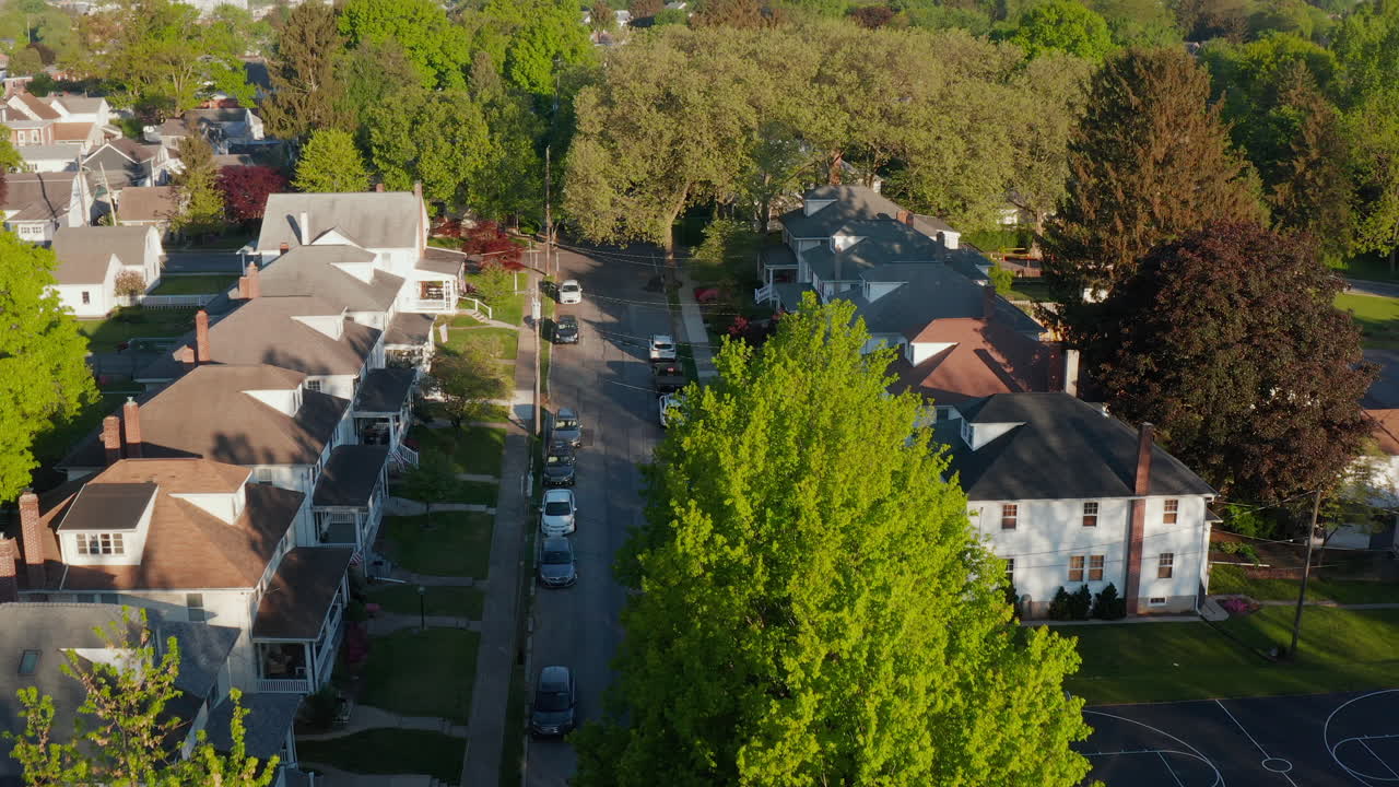 Aerial establishing shot of quiet neighborhood town