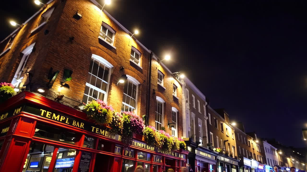 Nighttime view of Temple Bar street in Dublin with people