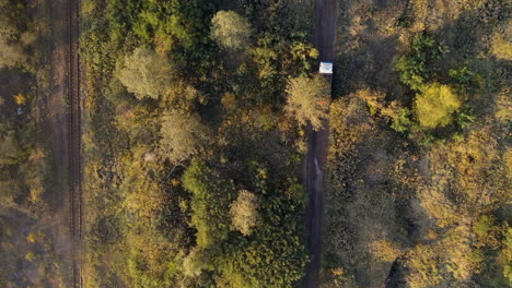 steady drone shot of a trick driving - dirt road in hungary