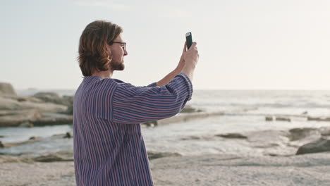 man, smartphone and photography of beach