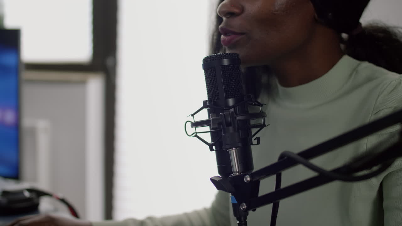 Close up of black streamer cyber performing space shooter video game