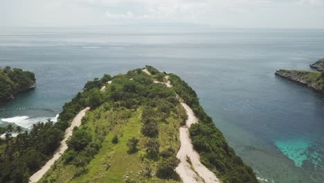 rising aerial reveals scenic tanjung juntil point with