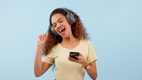 Dancing,-cellphone-and-woman-with-headphones