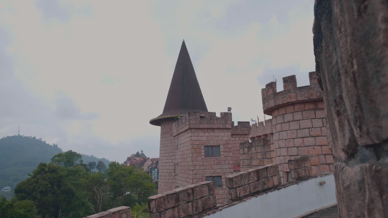 Cinematic shot of a brick castle near Colmar French Village in Malaysia on a cloudy day.