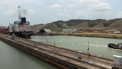 tugboat exiting the pedro miguel locks, panama canal