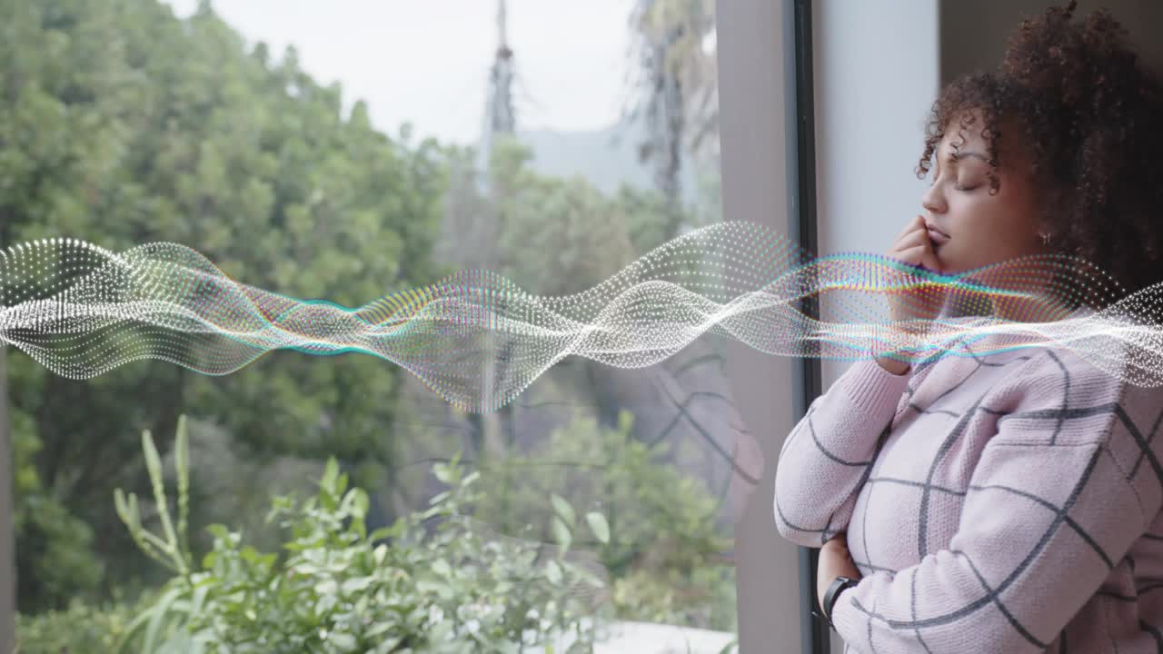 Woman by big window touching ear, activating waveform, listening and processing sound for audio
