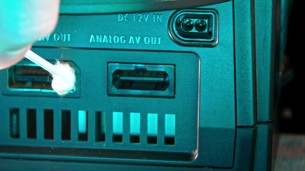Cleaning Output Ports on Back of Nintendo Gamecube Console SLIDE RIGHT