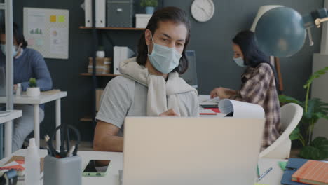 business people working in an office during pandemic