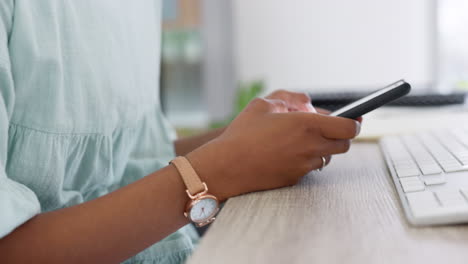 typing email on mobile phone at work