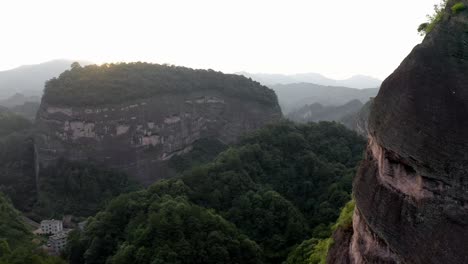 aerial: bajiaozhai shan mountain valley in china countryside, sunset landscape