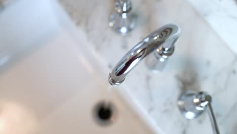 Top-Down-View-Of-Sink-Running-Water-In-Slow-Motion