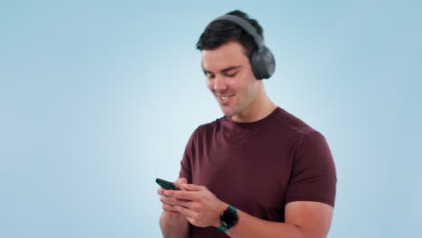 Headphones,-smartphone-and-man-is-dancing-to