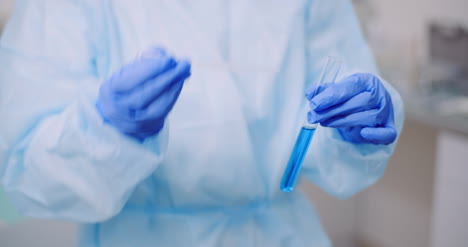 Portrait-Of-Female-Scientist-Analyzing-With-A-Pipette-At-Laboratory-