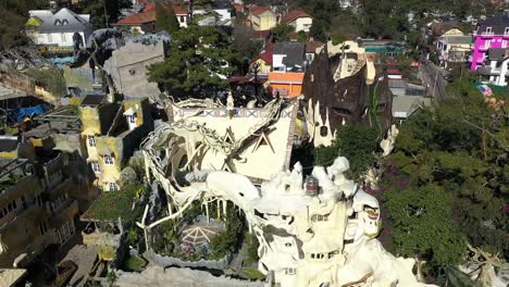 an aerial view shows tourists exploring the crazy house of dalat vietnam