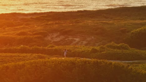 woman on the beach at sunset