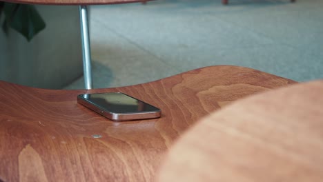 close up of a smartphone on a wooden chair