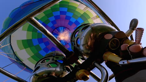 hot air from gas burning fired into a large hot air balloon