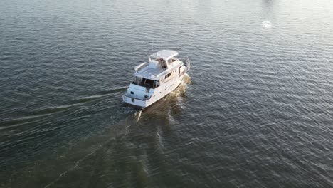 luxury yacht sailing towards the lakeshore drive in new orleans, usa. aerial