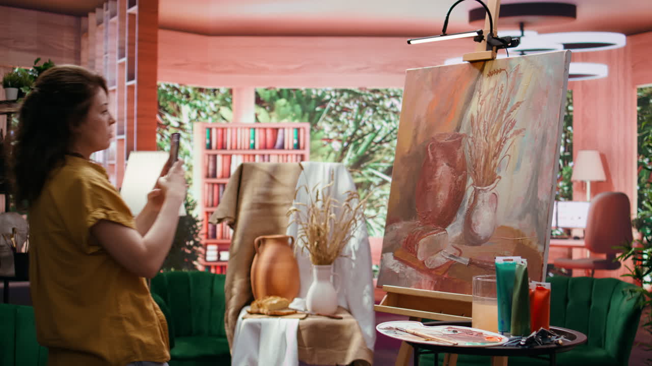 Woman creating a still life painting in studio