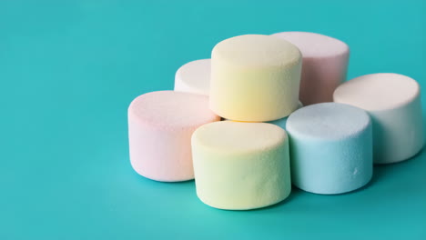 colorful marshmallows on a blue background