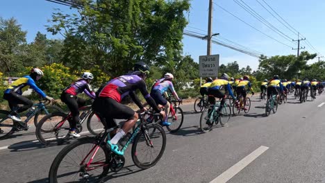 group of cyclists competing on a sunny day