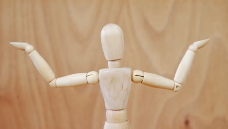 Figurine-standing-with-arms-stretched