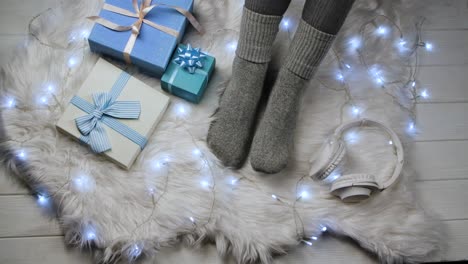 Cozy Christmas Feet with Gifts and Headphones