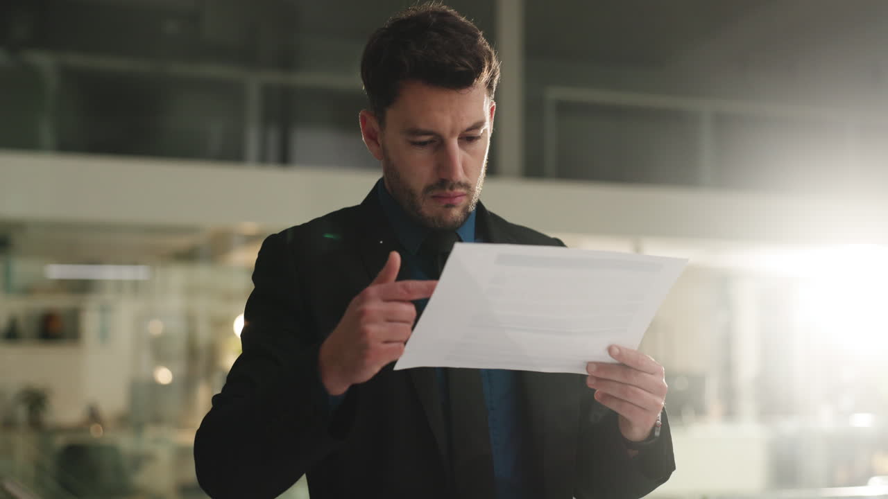 Businessman Holding Document in Office