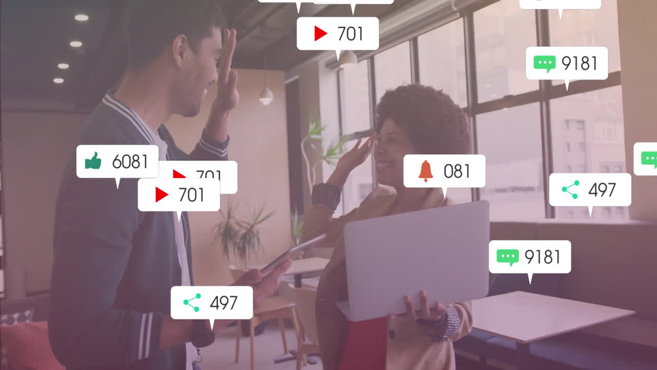 Celebrating engagement metrics, diverse colleagues using animation in modern office