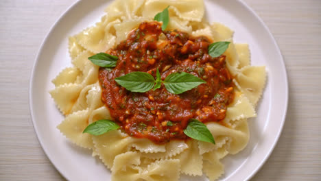 farfalle pasta with basil and garlic in tomato sauce - italian food style