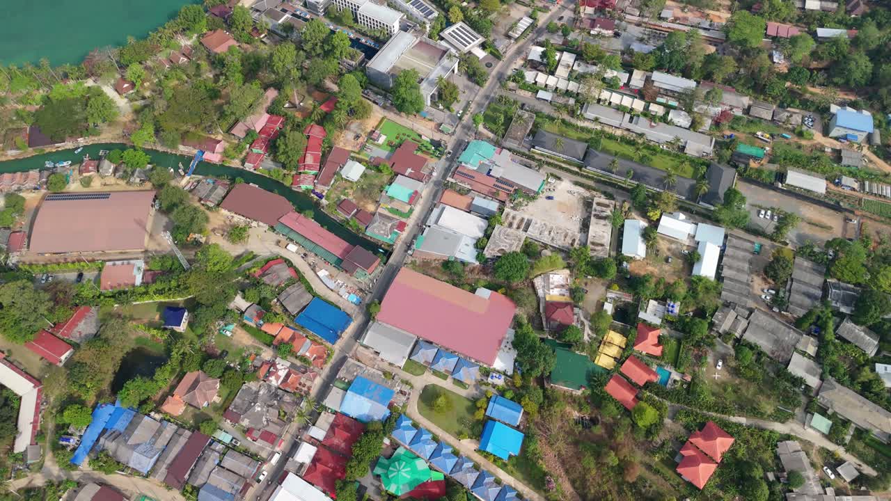 aerial drone footage of Koh Chang island, Kai Bae village with roads, shops , hotel accommodation and roof tops