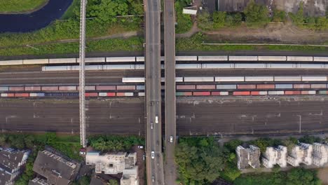 bird's eye view of roads with vehicles traveling and railway station in vasai mumbai - aerial drone shot