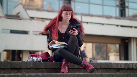 young woman caught playing with phone when she should be studying - in slow motion