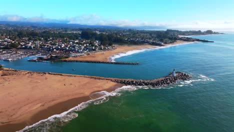 seabright blacks beach walton lighthouse monterey bay santa cruz california aerial drone scenic landscape deep blue surf waves sand pacific ocean pleasure point morning blue sky mist fog circle right
