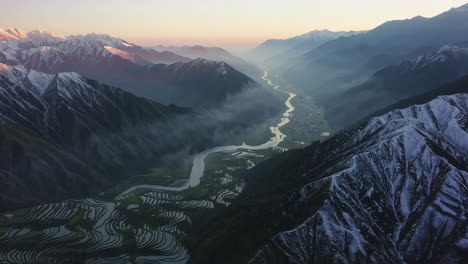 sunrise over mountain valley with rice terraces