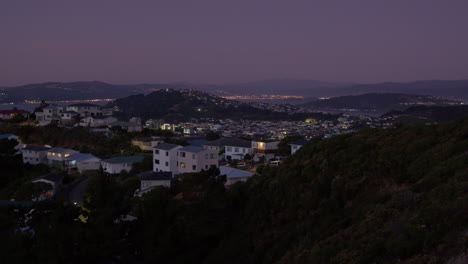 Pan-over-the-residential-area-of-Wellington-at-dusk,-the-capital-of-New-Zealand