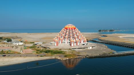 aerial of unique and stunning asmaul husna 99 dome mosque in makassar, sulawesi, indonesia