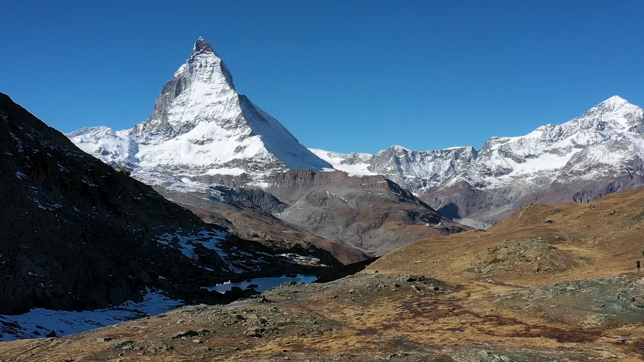Matterhorn peak reflection in Stellisee Lake in Zermatt, Switzerland.Perfect Sunny day, clear sky
