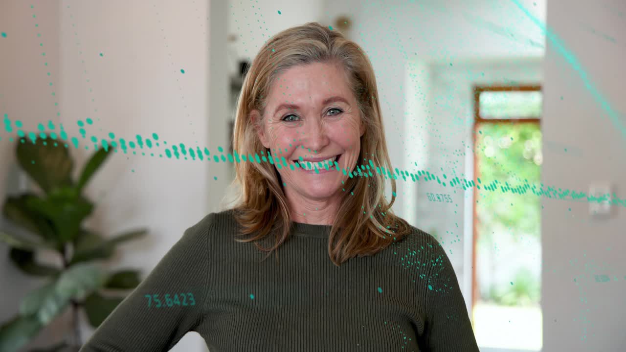 Woman sipping turquoise mug in kitchen on offscreen cue, turquoise dots near-eye promoting homeware