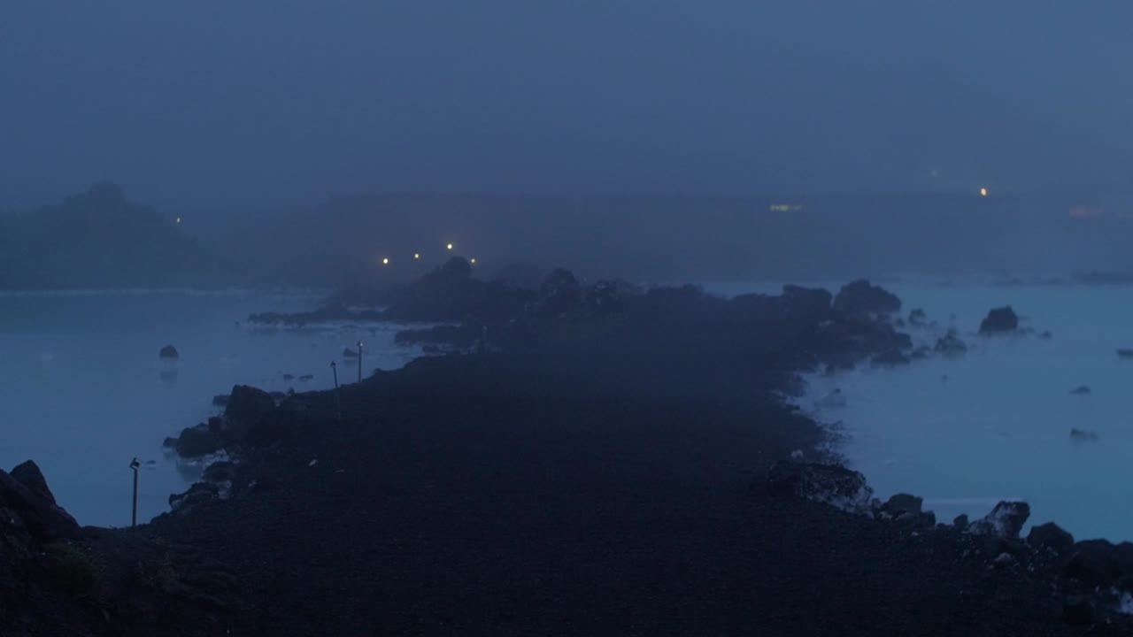 iceland, blue lagoon, Svartsengi geothermal power station at night, fog rolling over the blue water, no camera movement