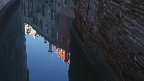 venice, italy – multicolored buildings reflected in canal water